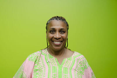 Danielle is smiling.