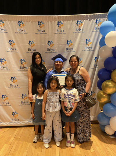 picture of a Briya graduate surrounded by his family