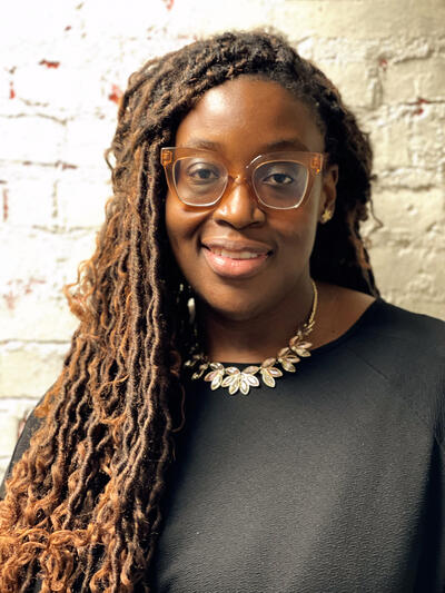 woman with braids smiling