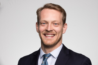 Will Henderson is smiling.