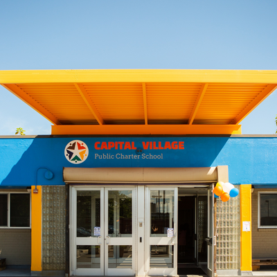 a photograph of the front of the Capital Village PCS school