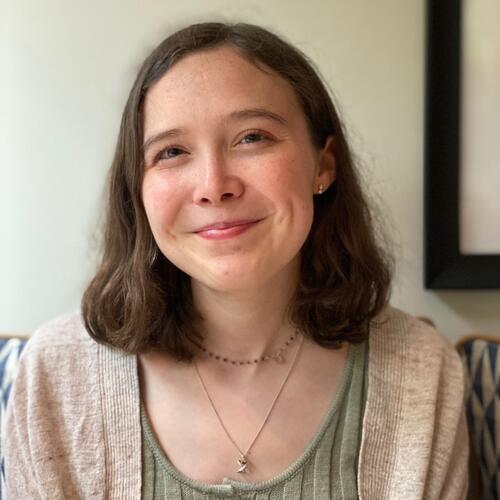 Isabel Hardy is smiling.